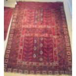 A Turkoman Hatchli rug, the central panel set with two further panels,
