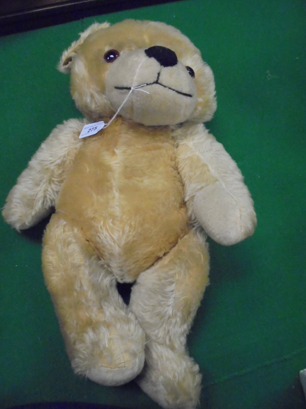 A German (probably) gold plush bear with growler,