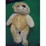 A German (probably) gold plush bear with growler,