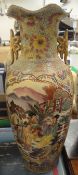 A modern Japanese vase decorated with figures in a garden setting playing music