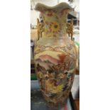 A modern Japanese vase decorated with figures in a garden setting playing music