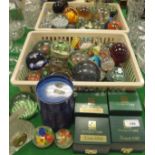 Two baskets and contents of various glass paperweights including millefiori examples,