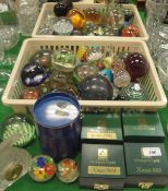 Two baskets and contents of various glass paperweights including millefiori examples,