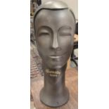 A silvered plaster advertising figure head inscribed "Battersby Hats" in the Art Deco style