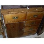 A pine unit of five assorted drawers and a single cupboard door to plinth base