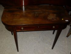 An early 19th Century mahogany fold-over tea table on square tapered legs