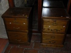 Two oak filing cabinets of two drawers to plinth bases