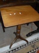 A mahogany Pembroke table on square sectioned legs, a mahogany side table,