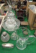 A collection of various cut glassware including vases, lidded jars, fruit bowl,