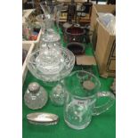 A collection of various cut glassware including vases, lidded jars, fruit bowl,