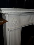 A white painted fire surround,