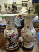 A pair of 19th Century Chinese polychrome glazed baluster shaped vases decorated with pheasants