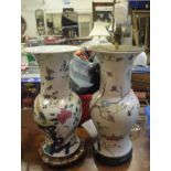 A pair of 19th Century Chinese polychrome glazed baluster shaped vases decorated with pheasants