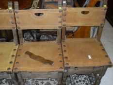A set of six oak framed dining chairs with leather seats and backs
