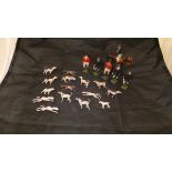 A large collection of Britain's painted hollow cast farm animals, pigs, sheep, chickens,