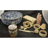 A William Adams blue and white bowl containing various 19th and early 20th Century carved ivory