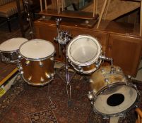 A four piece drum kit including Premier snare