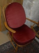 A light elm Ercol easy chair,