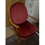 A light elm Ercol easy chair,