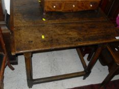 A 19th Century oak occasional table, the plank top with cleated ends,