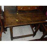 A 19th Century oak occasional table, the plank top with cleated ends,