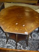 A 19th Century octagonal centre table with marquetry floral inlay on slender turned legs to united