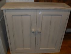 A pine wall hanging two shelf unit together with a cream painted two door wall hanging cupboard and