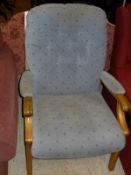 A plum coloured two seat sofa bed and an arm chair in duck egg blue,