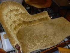 A Victorian mahogany framed chaise longue in mustard button back upholstery