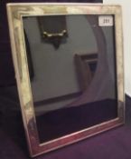 A modern silver photograph frame bears engraved inscription 