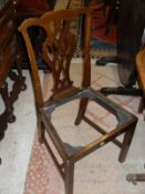 A set of eight early 20th Century mahogany framed dining chairs in the Chippendale taste with