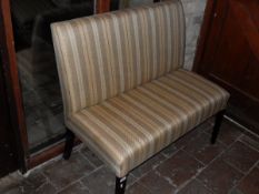 A two seat settle and single chair in oatmeal ground striped upholstery to square section tapering