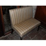 A two seat settle and single chair in oatmeal ground striped upholstery to square section tapering