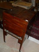 A mahogany wash-stand, the top opening to reveal a mirror and base with single drawer,