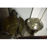 A large brass jam pan with swing overhead handle,