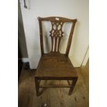 A pair of provincial elm Georgian dining chairs;