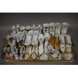 A collection of mainly continental early 20th century model ceramic shoes