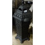 A cast iron hexagonal section room heater