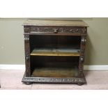 A Victorian carved oak side cabinet with lion mask and fruiting leaf carved frieze, carved uprights,