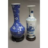 A Chinese blue and white vase of cylindrical form decorated in underglazed blue with boats,