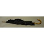 A vintage umbrella by Brigg & Sons of London, having a Whangee handle with 12ct gold collar,