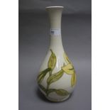 A Moorcroft Lily pattern vase, of slender ovoid form with tall trumpet neck, picked out in yellow,