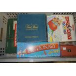 A quantity of games including Junior Monopoly, Monopoly, Pictionary,