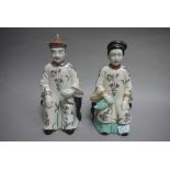 A pair of Chinese porcelain figures, Emperor and Empress,