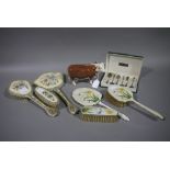 A Beswick Hereford bull, a silver plate and enamel engine turned three piece brush set, another,
