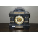 A French black slate mantel clock with two train movement and architectural case