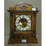 A fruitwood cased two train mantel clock with key