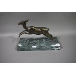 A bronze figure of a leaping fawn,