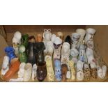 A quantity of late 19th and early 20th century model ceramic and glass shoes,