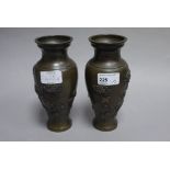 A pair of late 19th century Japanese bronze vases decorated with cranes and chrysanthemums
